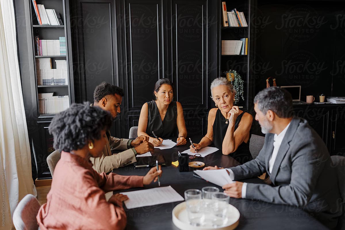 Neal & Leroy attorneys reviewing a case together in the boardroom